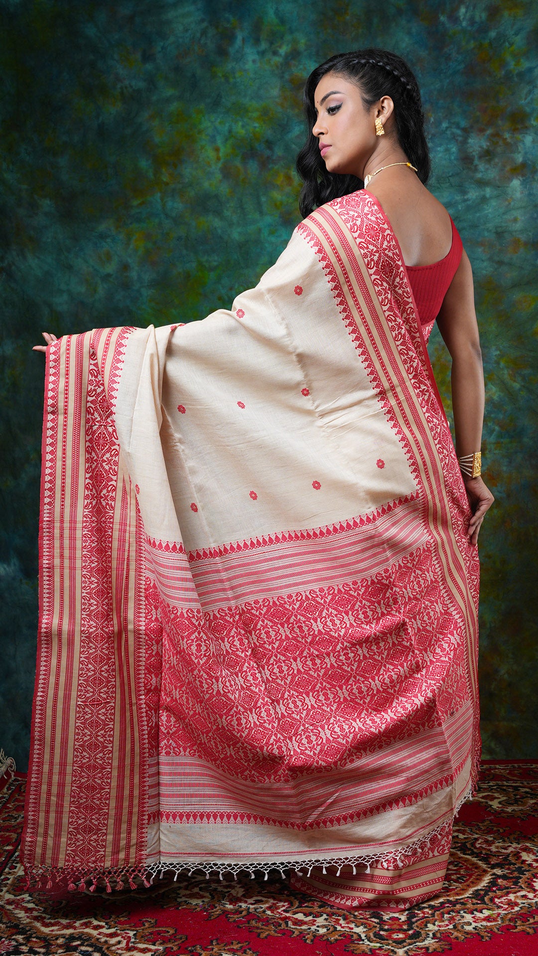 A tassar saree with red border