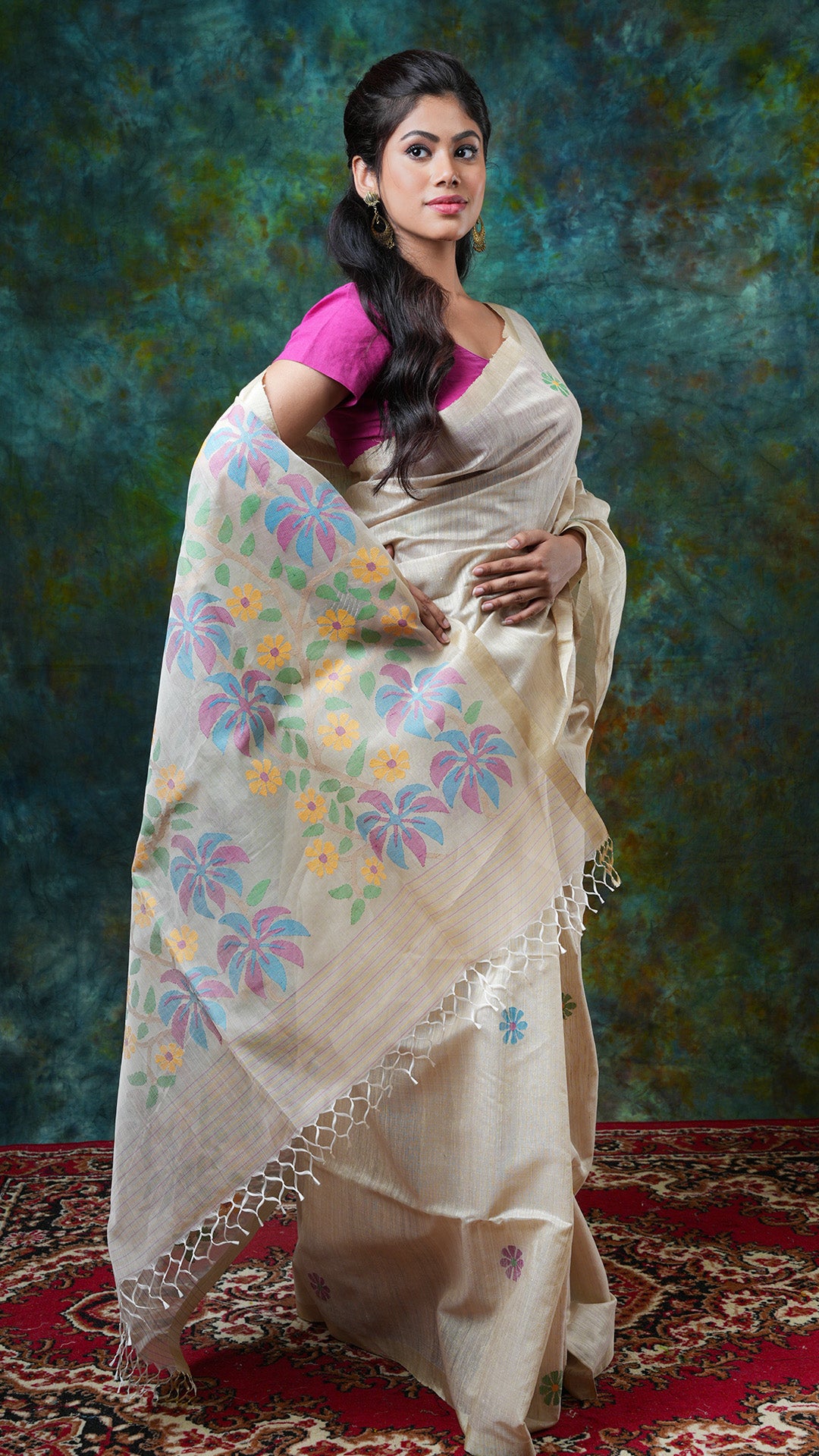 A dark off white raw silk saree