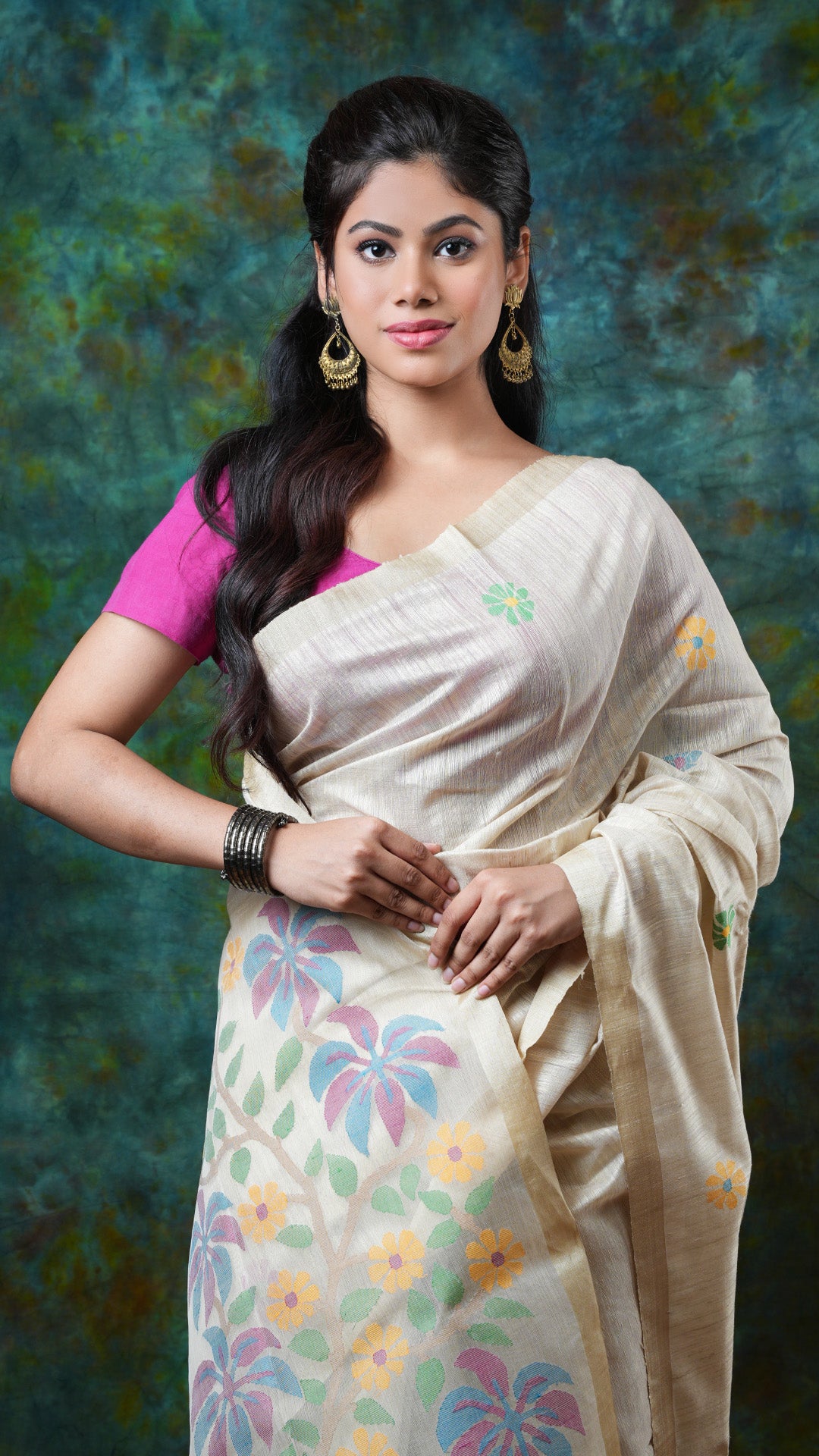 A dark off white raw silk saree