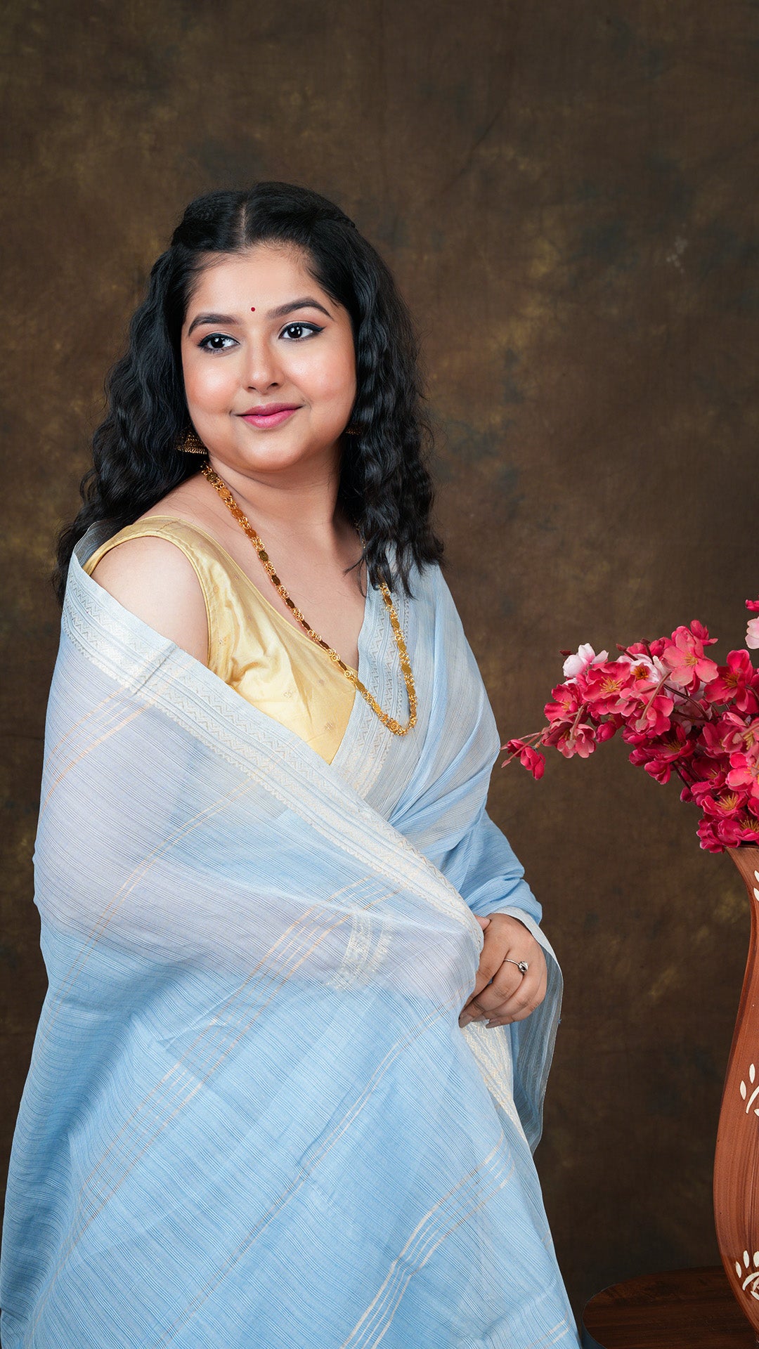 A sky blue coloured tangail saree