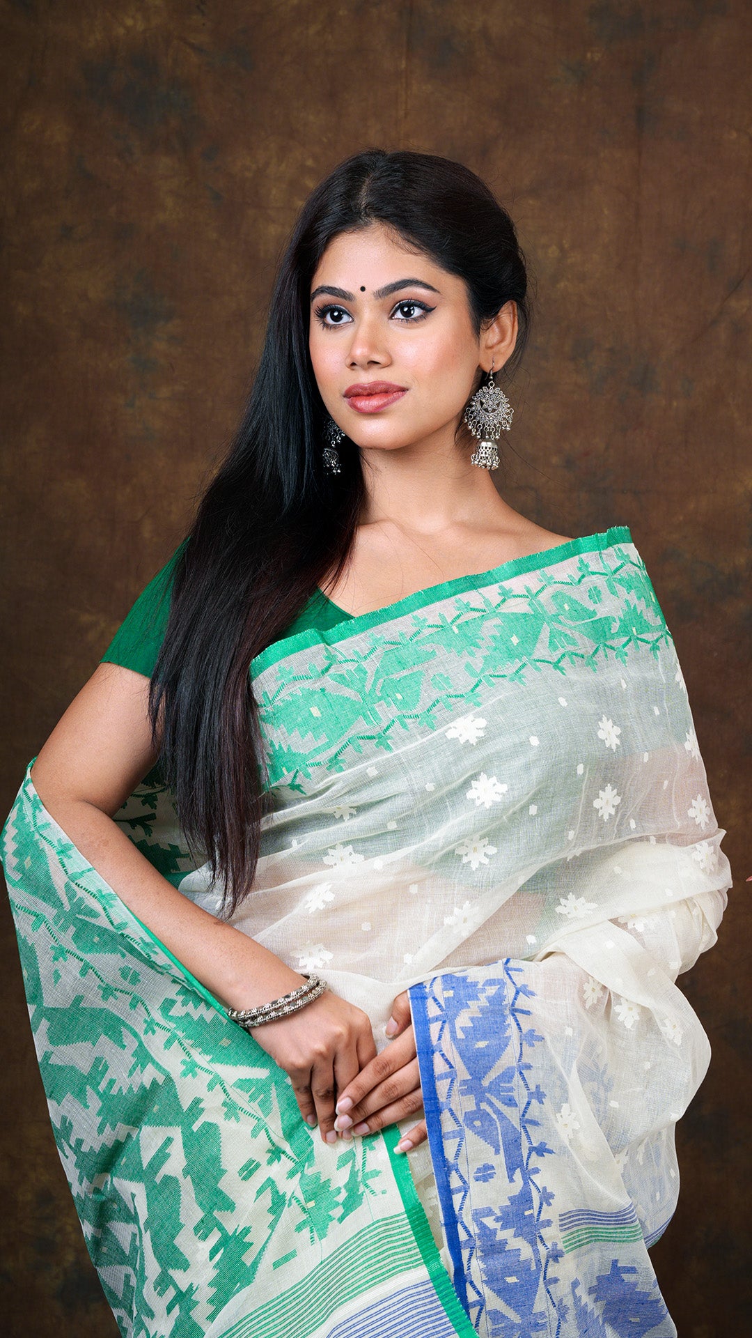 An off white jamdani saree