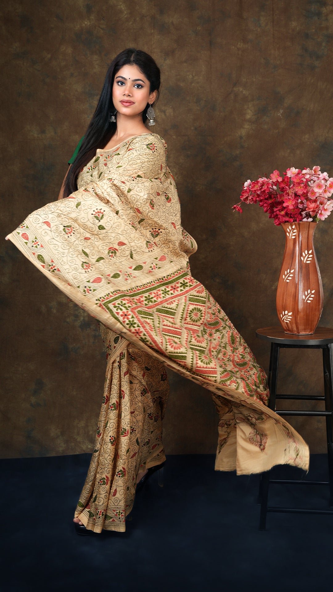 A kanta saree in dark beize colour