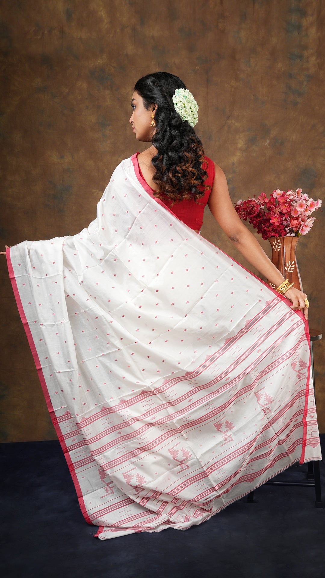 An off white red silk saree