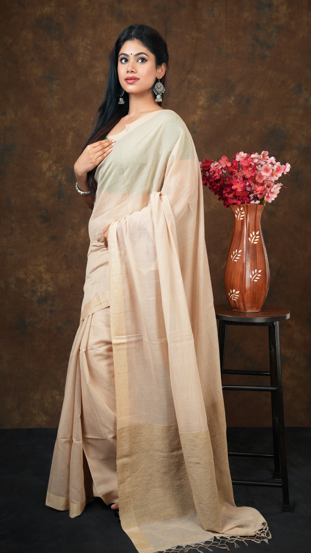 A beize saree with tassar border