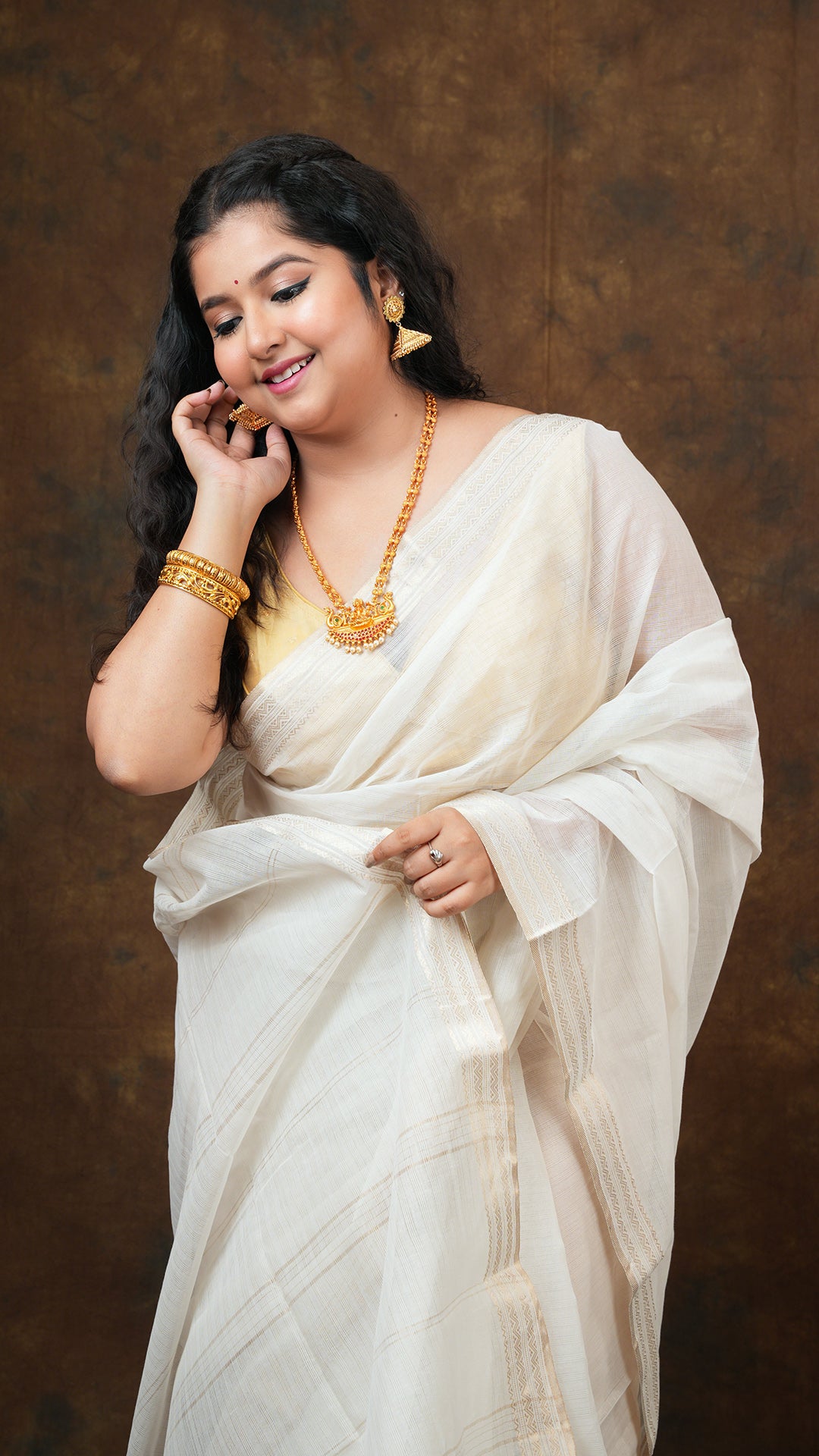 An off white tangail saree