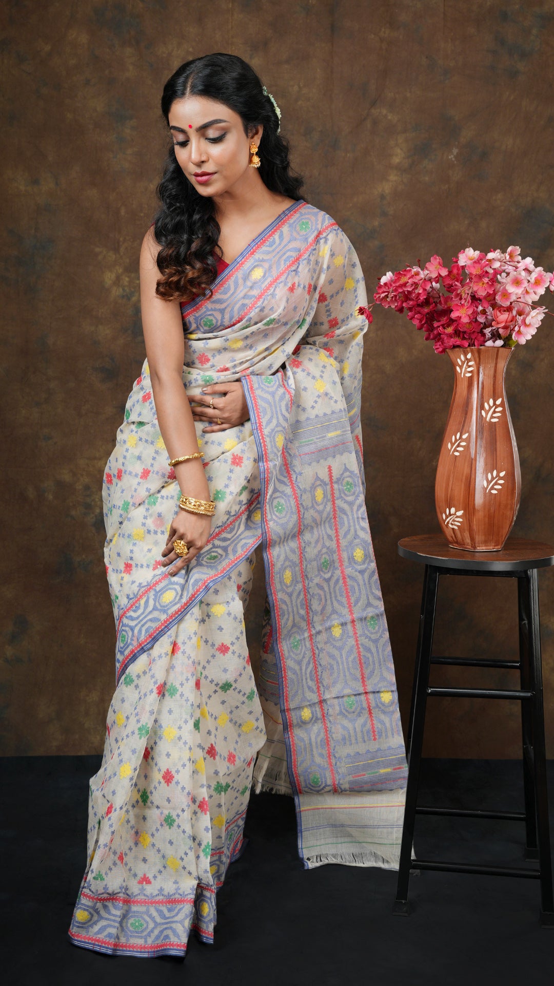 A blue multi coloured cotton jamdani saree