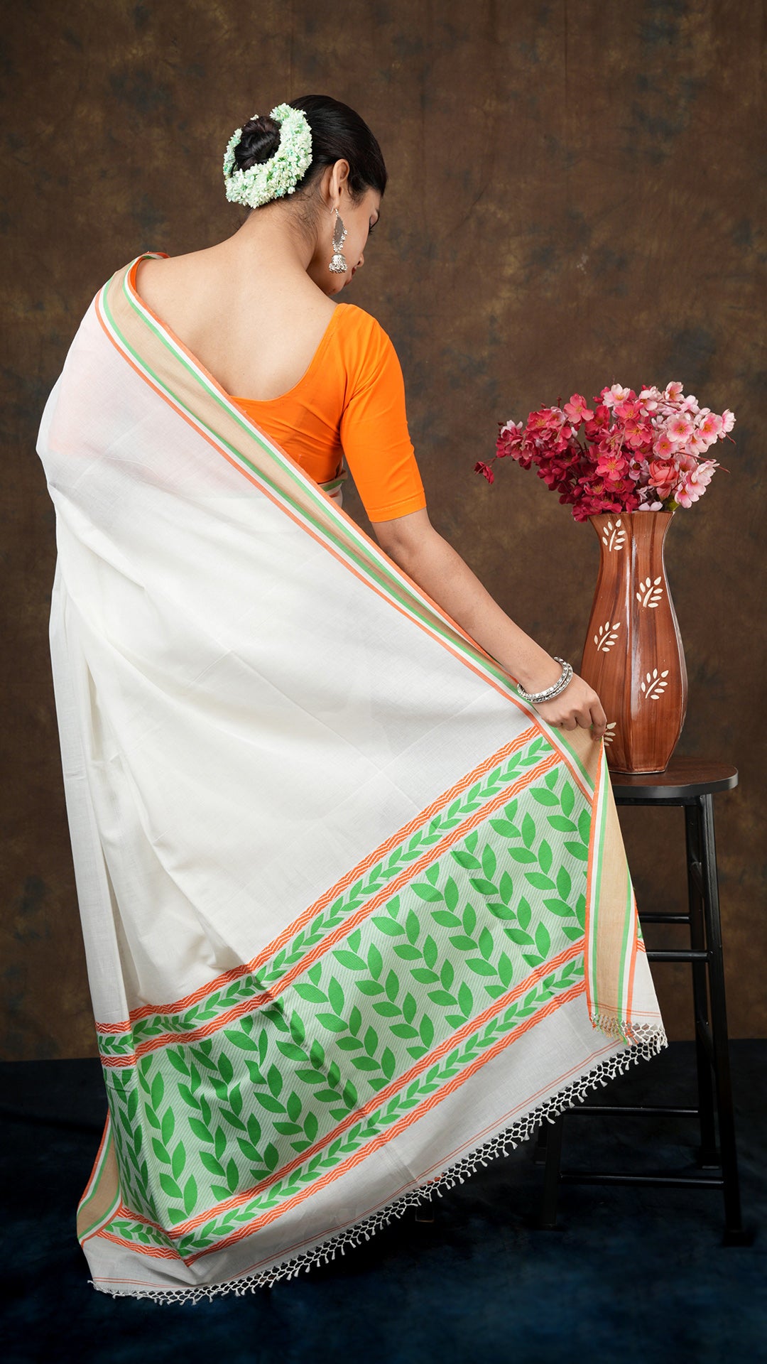 An off white tangail saree