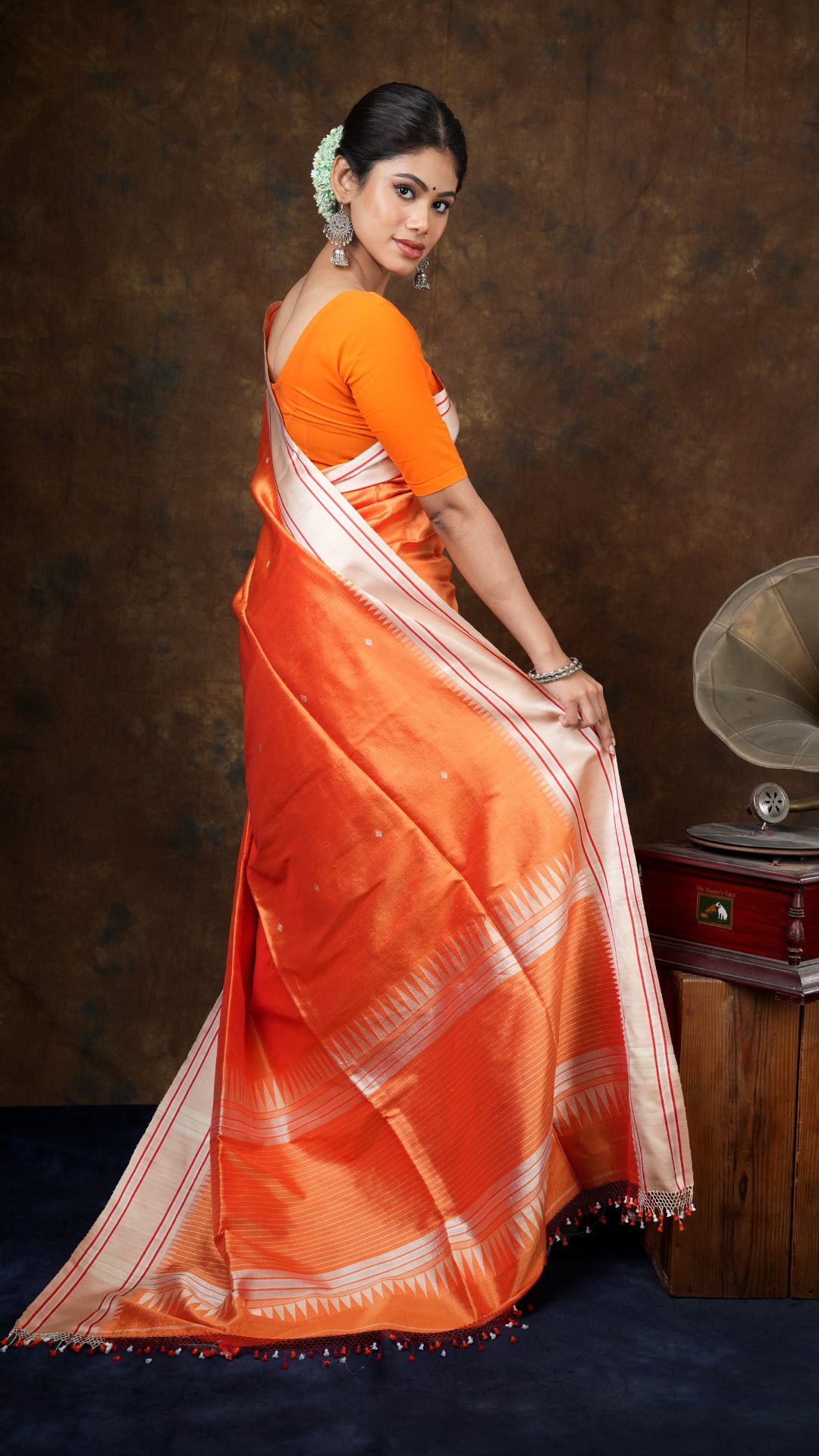 An orange silk saree