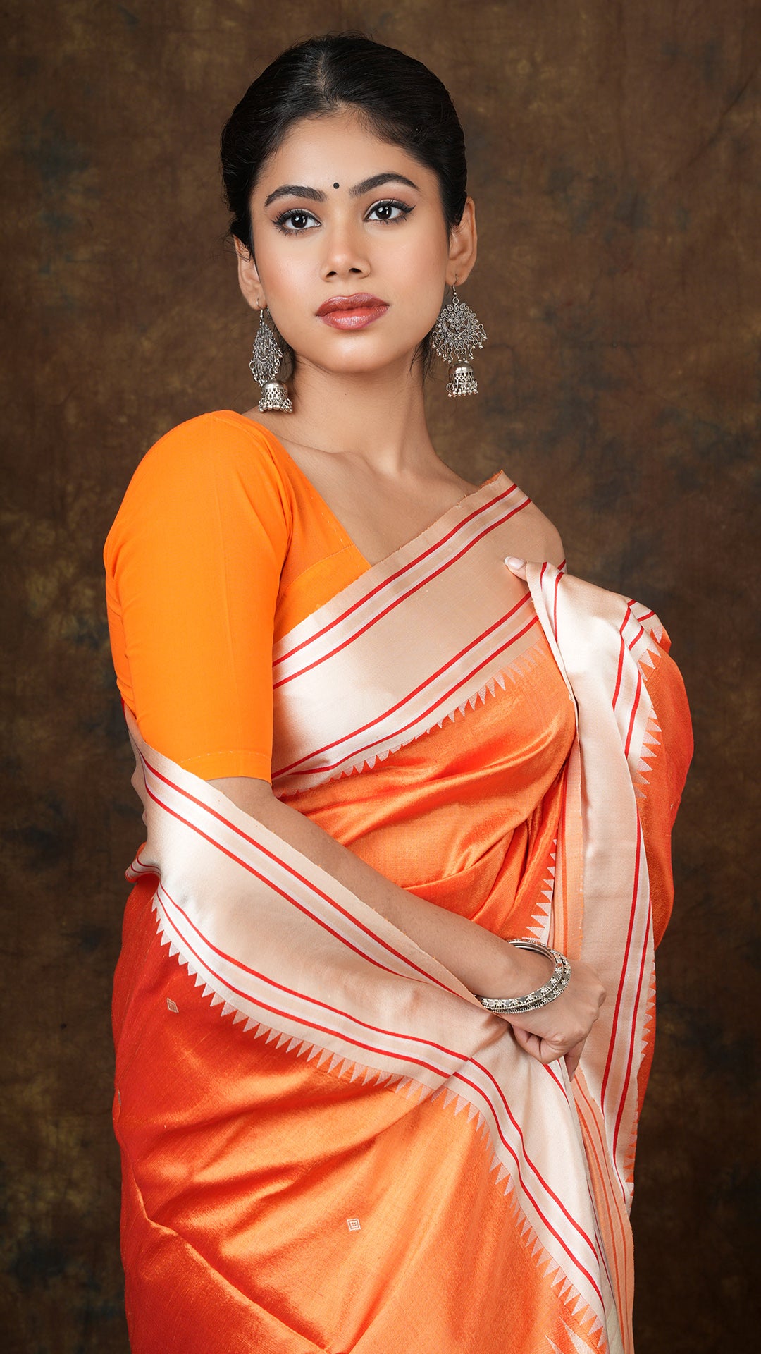 An orange silk saree