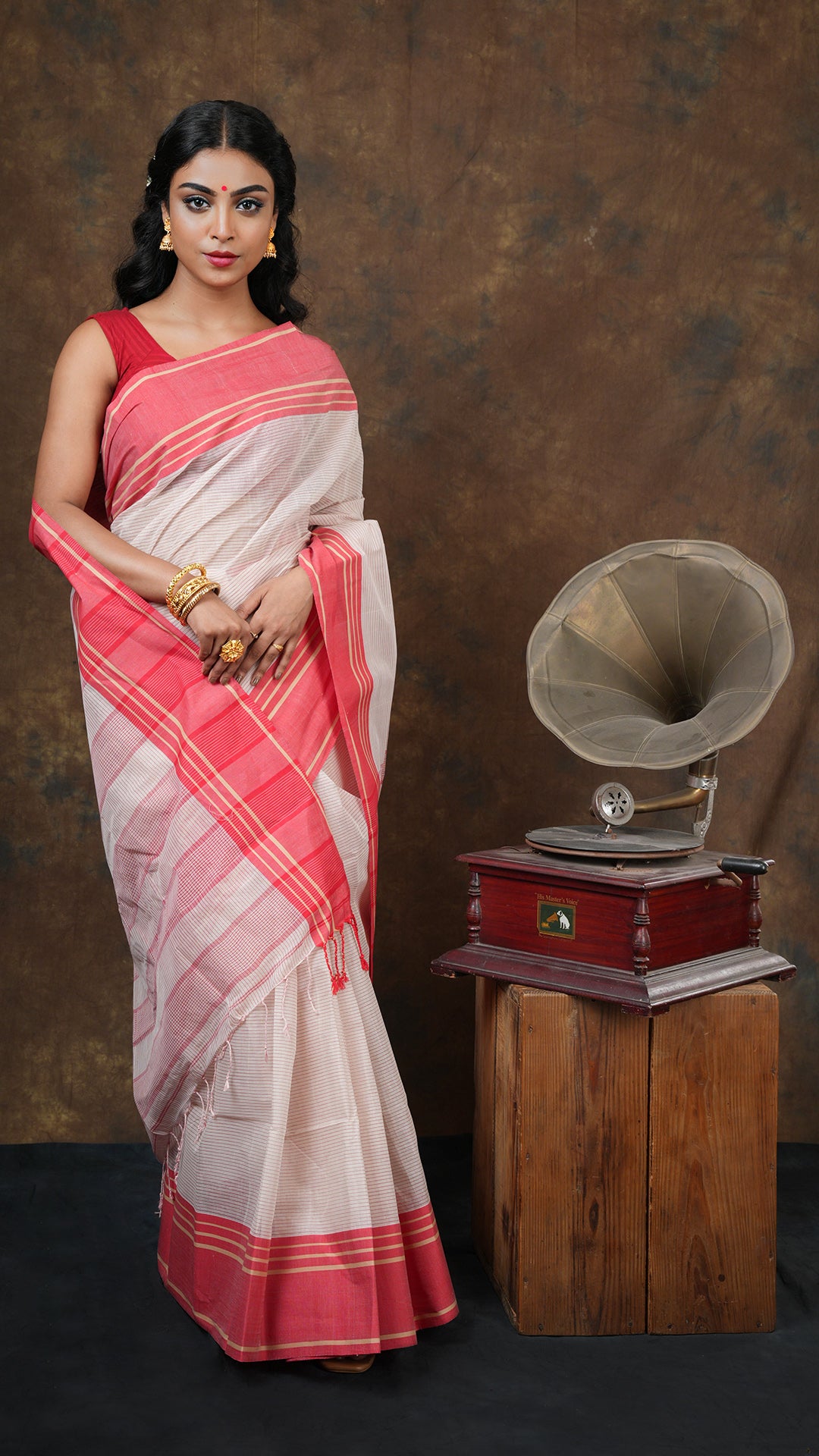 An off white stripped saree