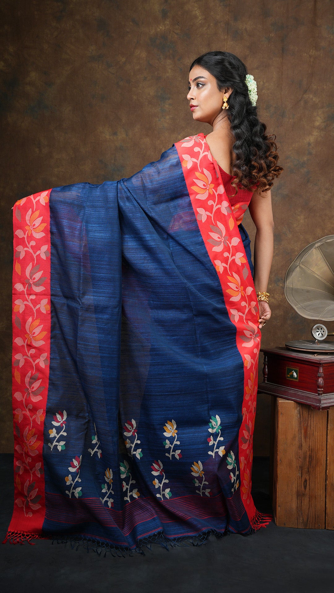 A deep blue raw silk saree
