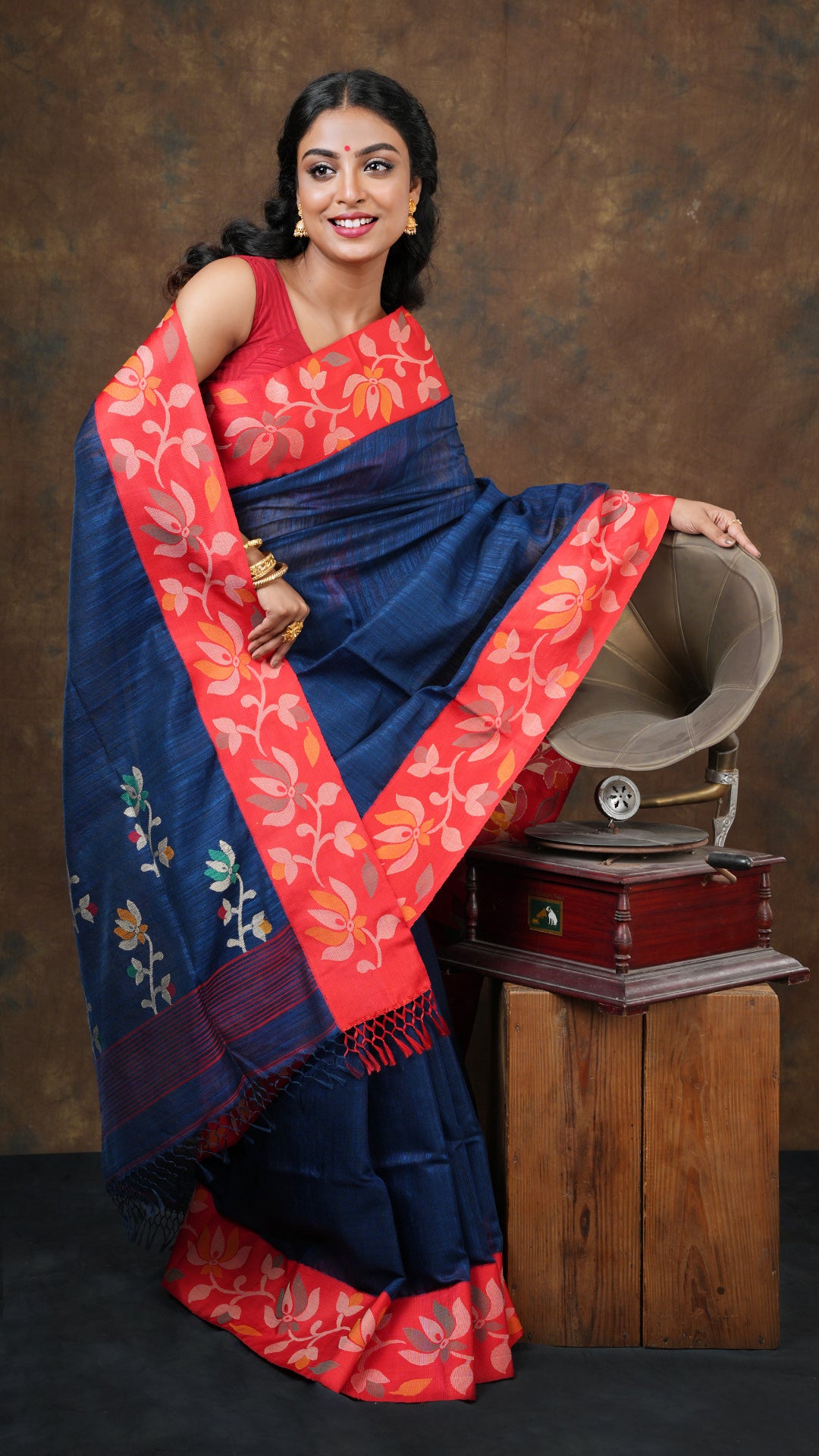 A deep blue raw silk saree