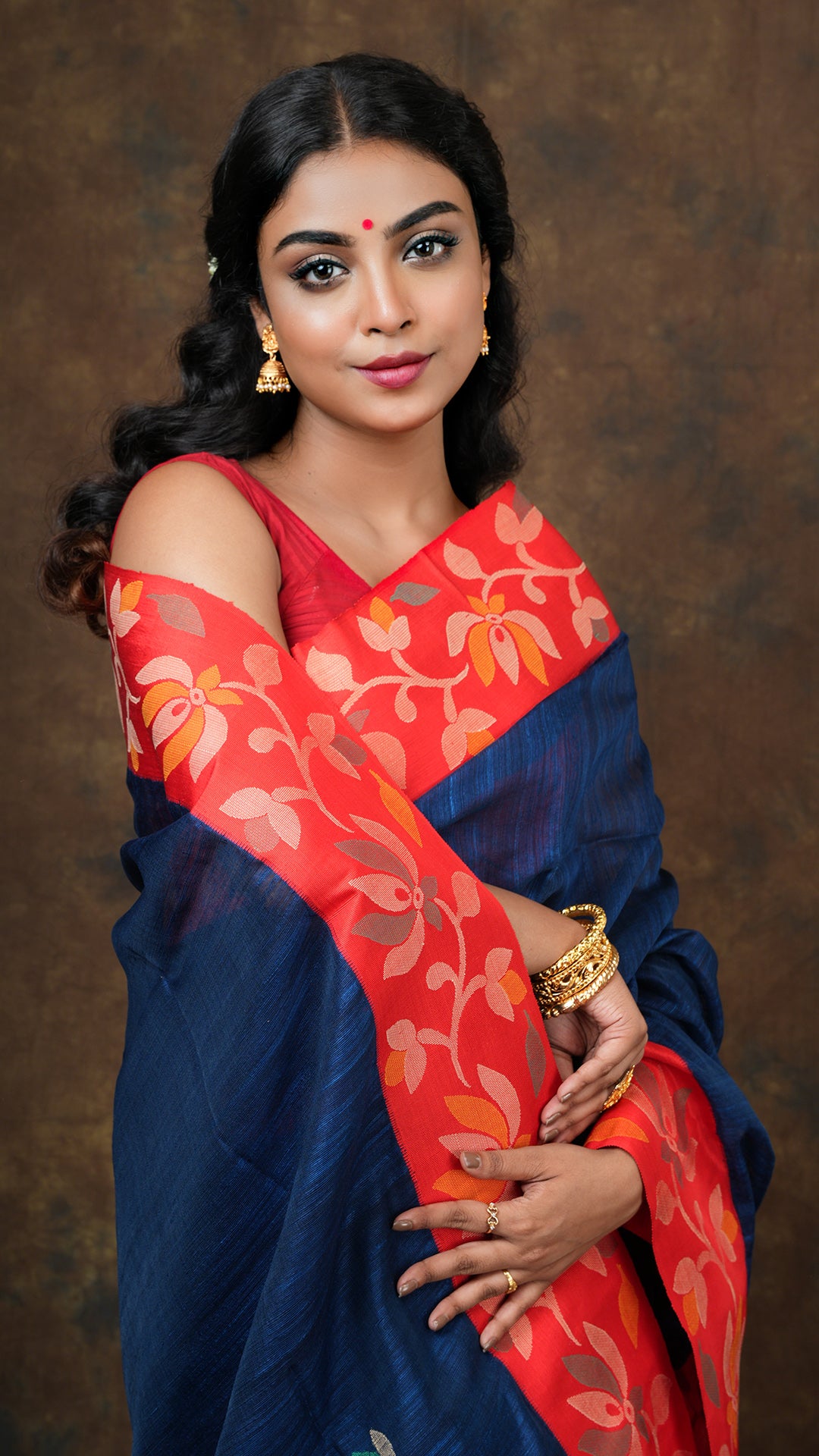 A deep blue raw silk saree