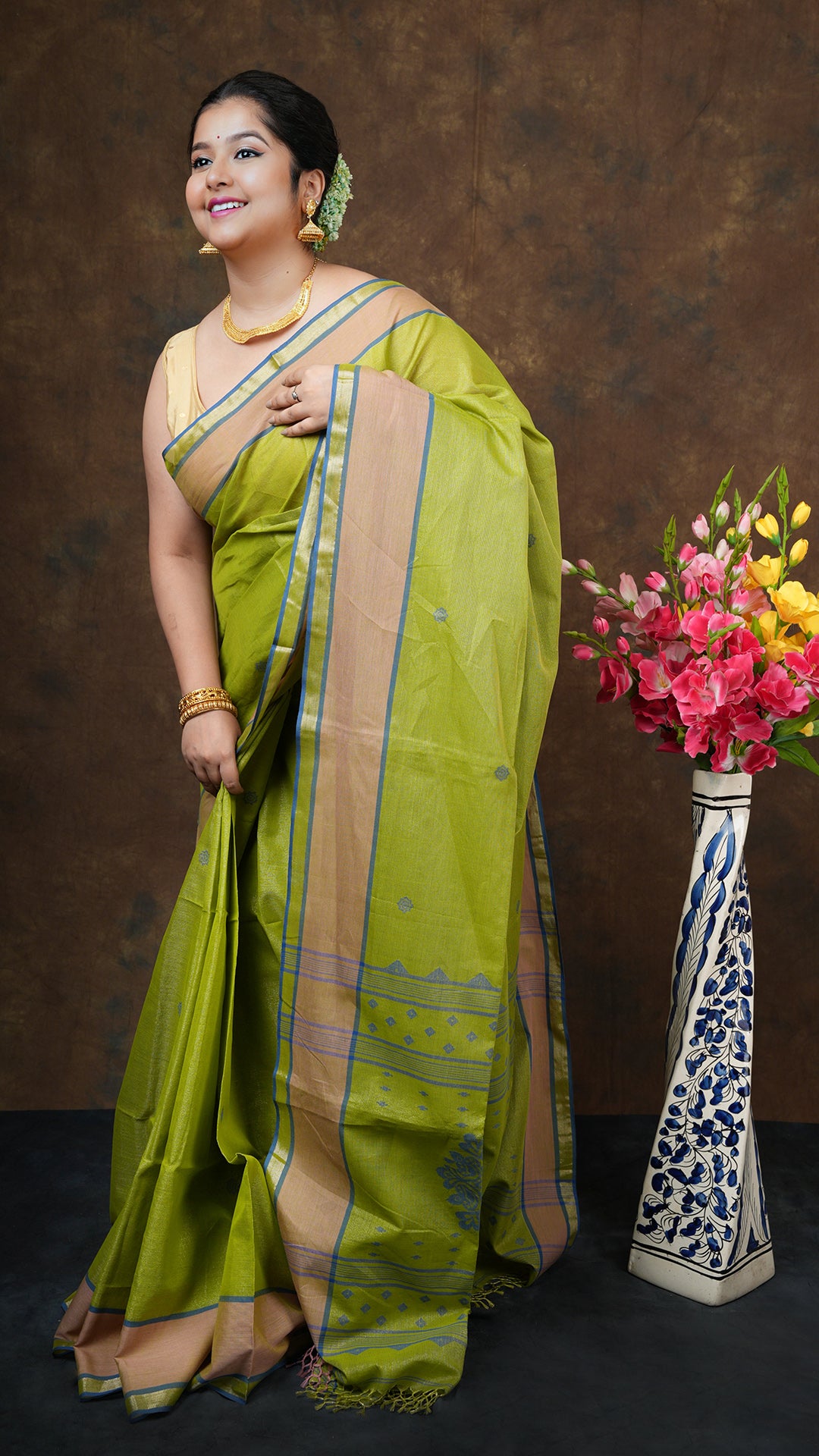 A bright green tissue saree