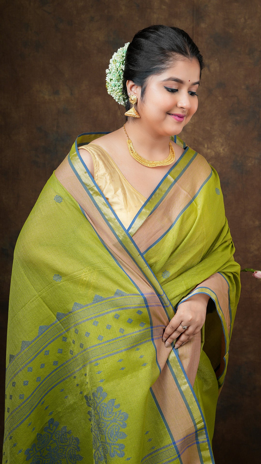 A bright green tissue saree