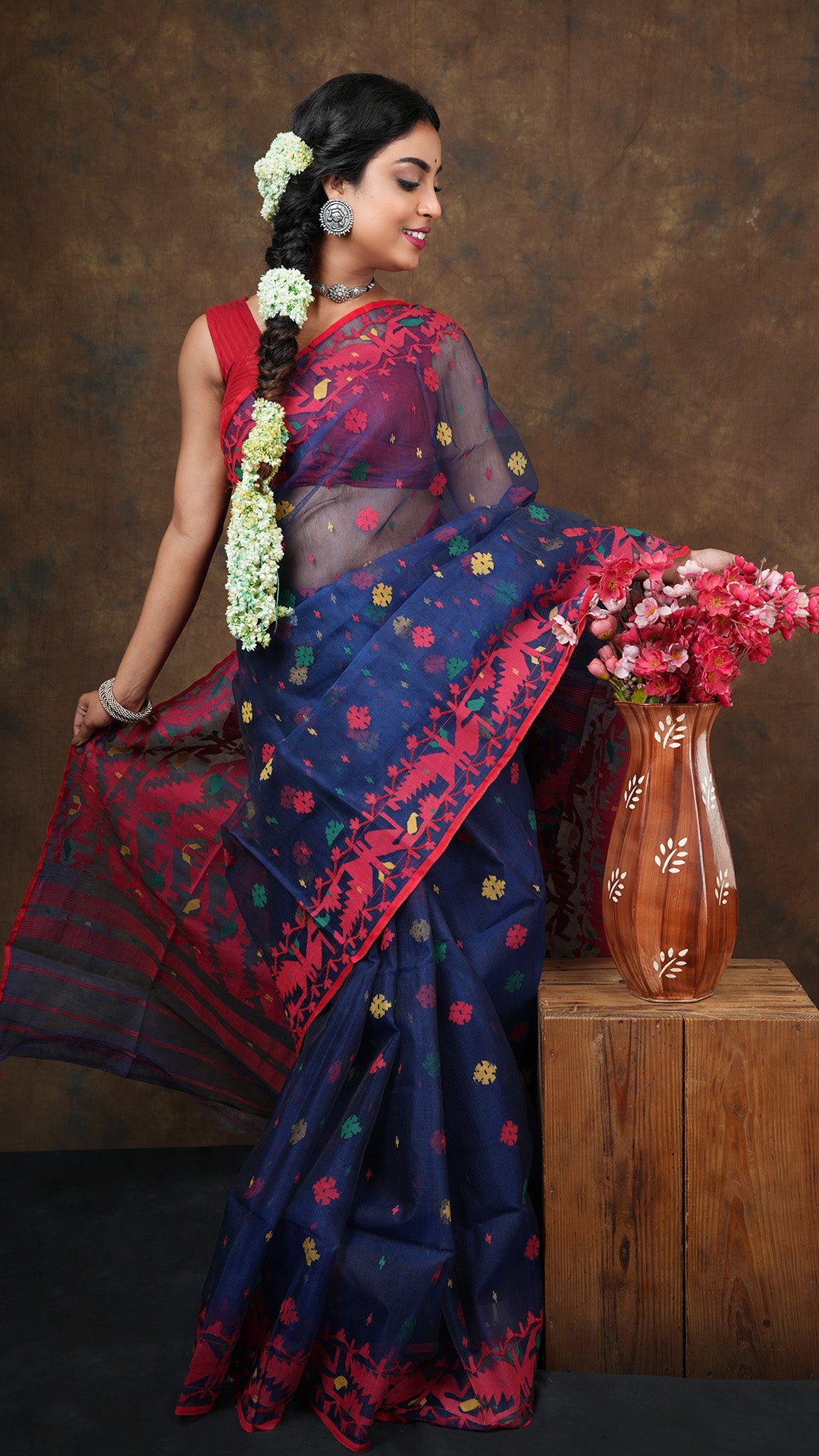 A navy blue multi coloured jamdani saree