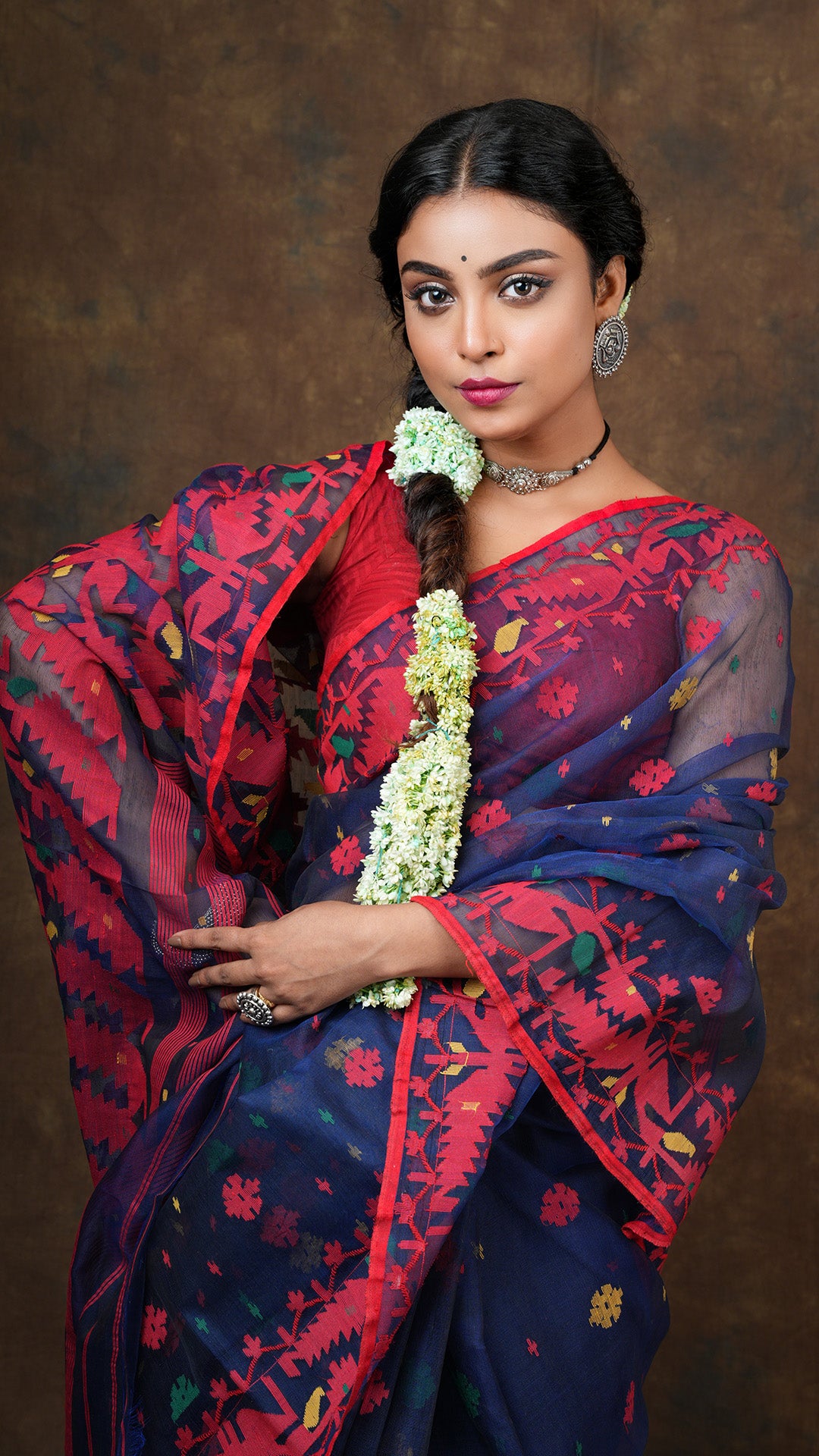A navy blue multi coloured jamdani saree