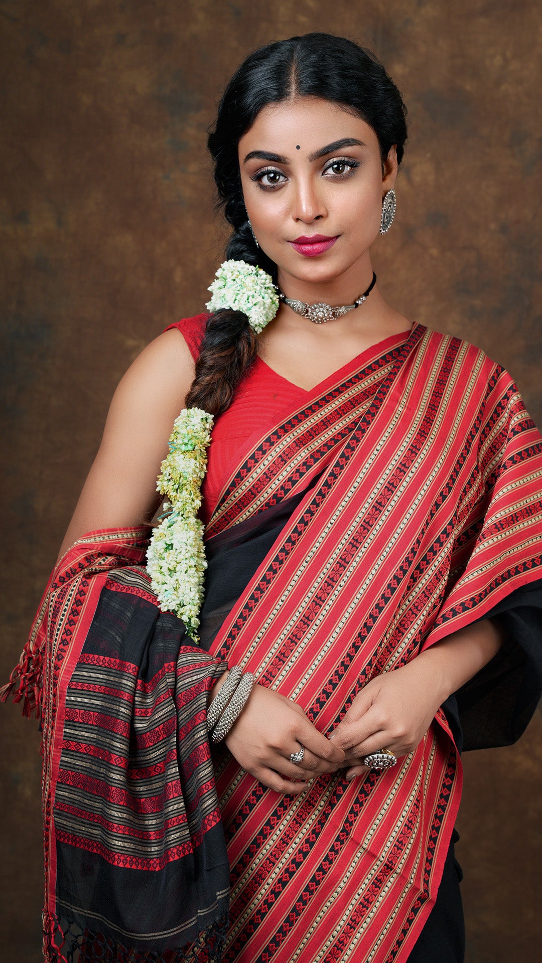 A black and red tangail saree