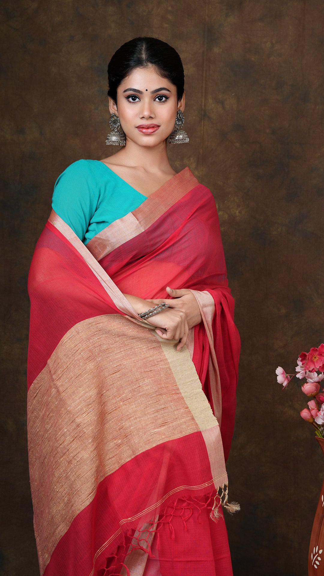 A red coloured tangail saree