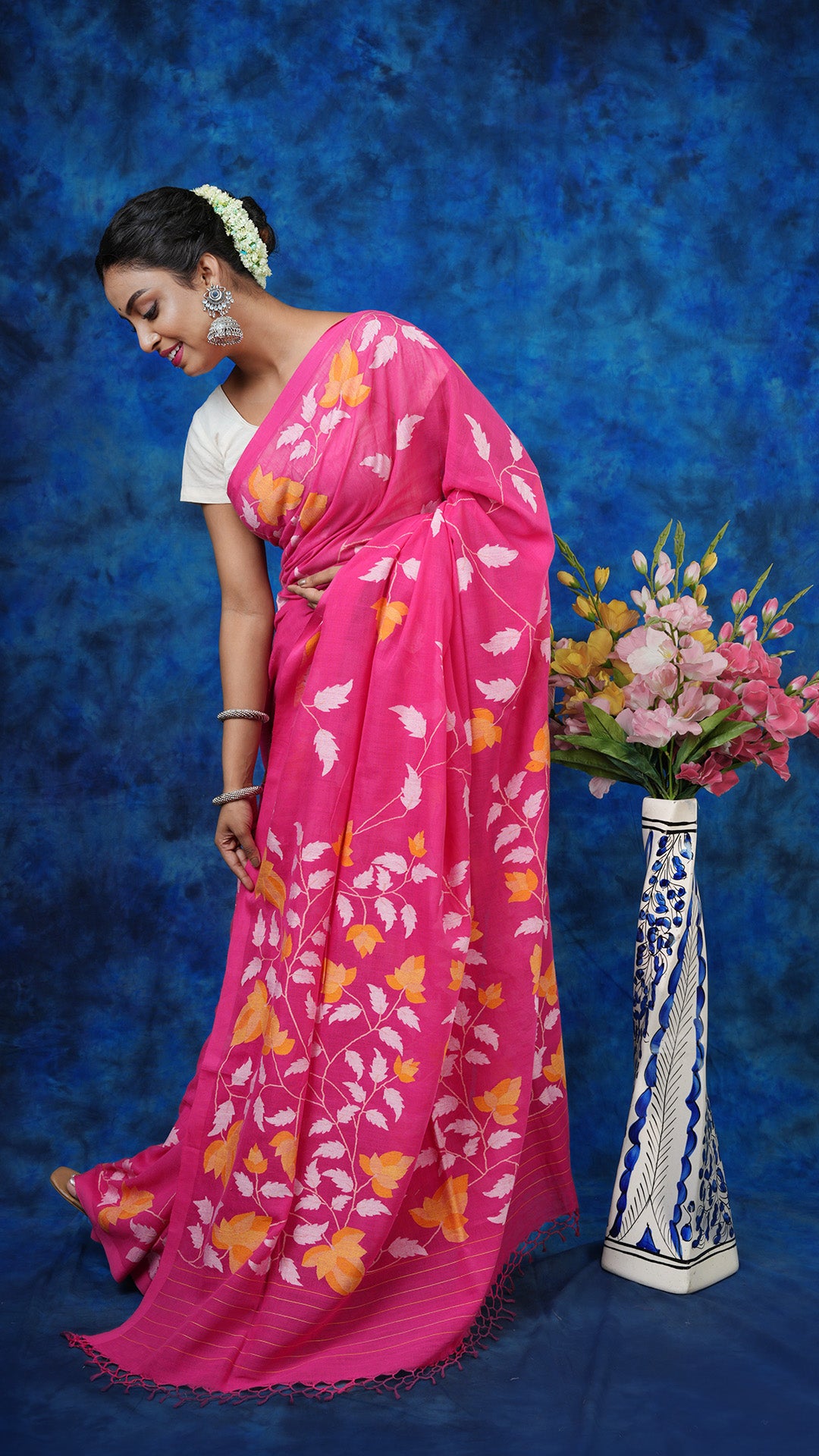 A pink coloured dhakai saree