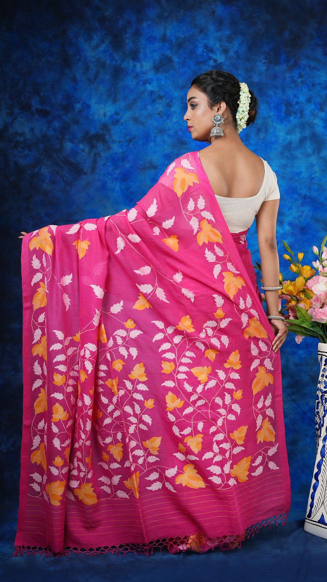 A pink coloured dhakai saree