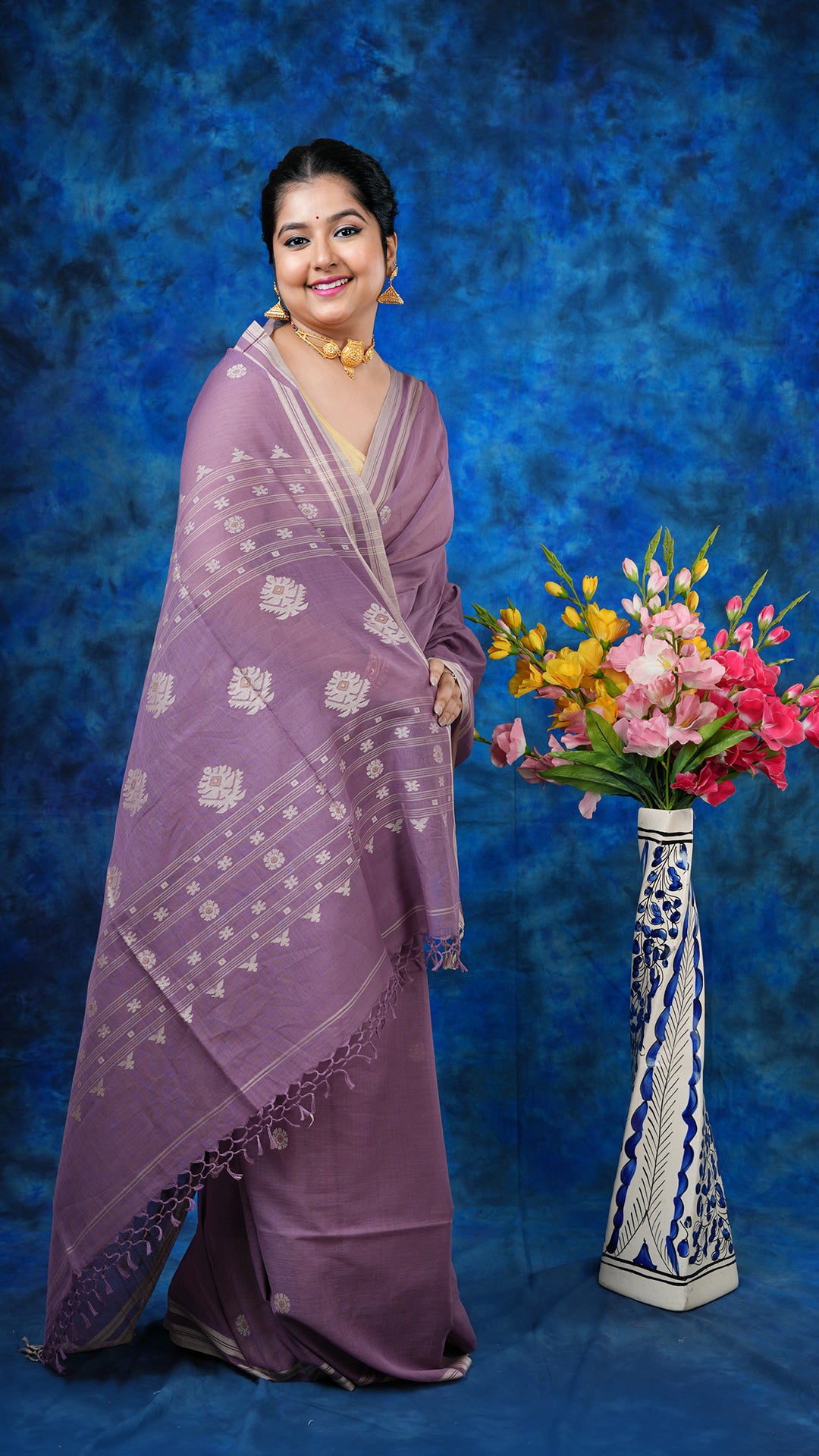 A deep mauve with beize saree