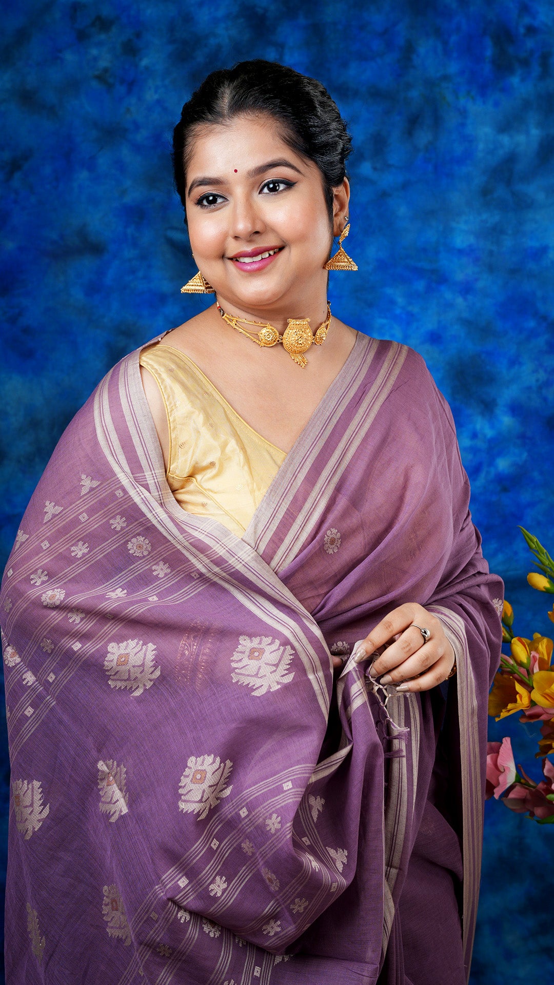 A deep mauve with beize saree
