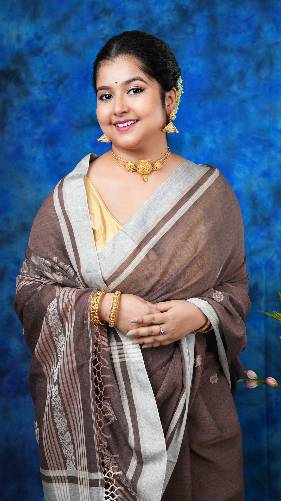 A brown colour tangail saree