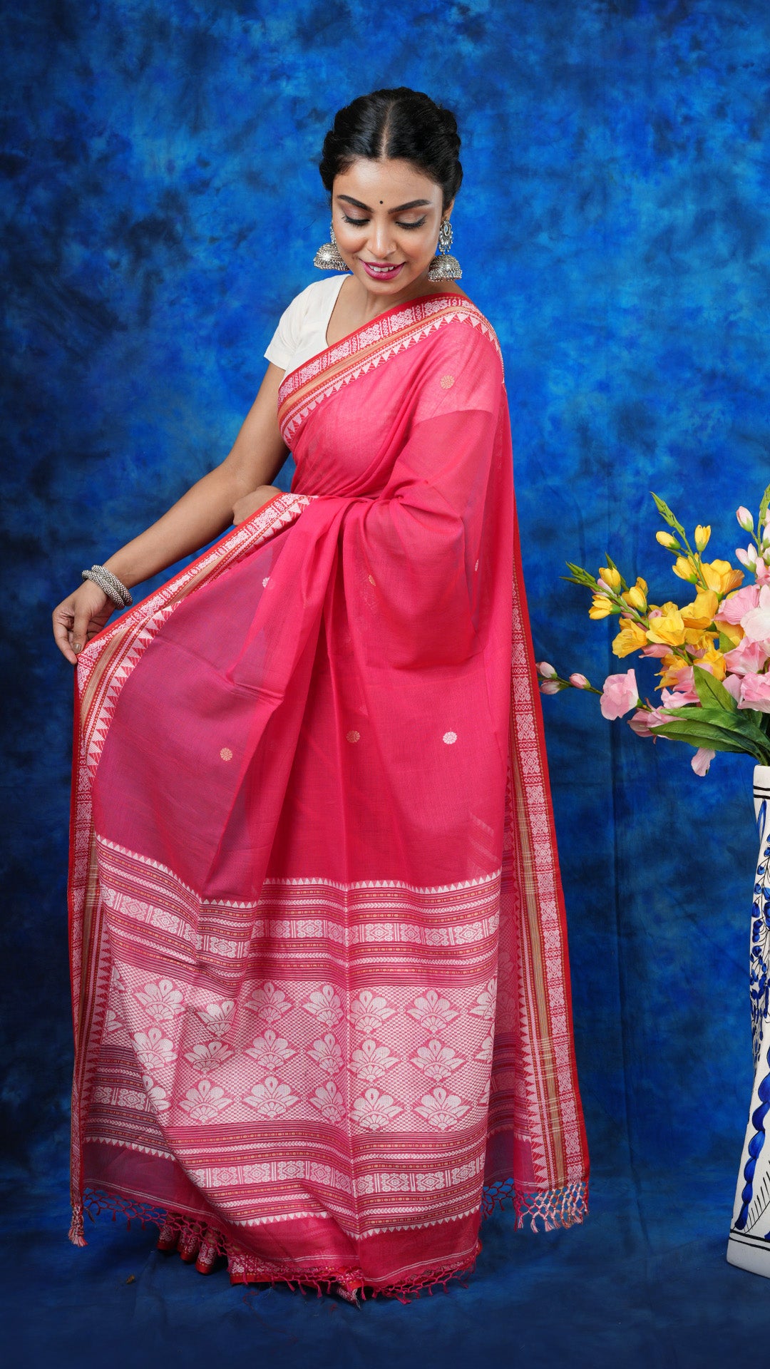 A bright pink tangail saree