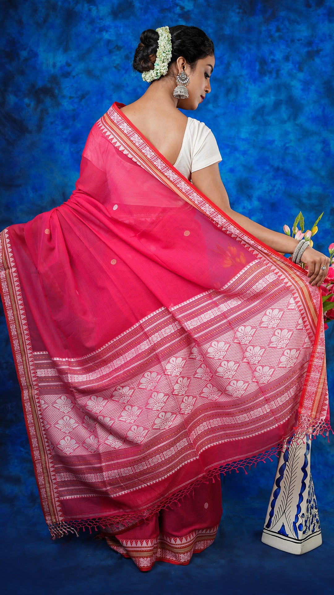 A bright pink tangail saree