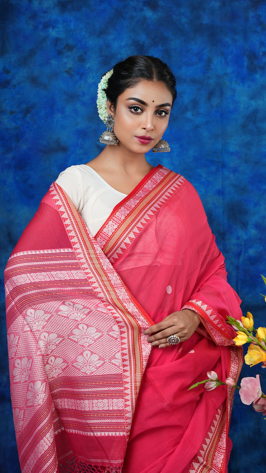 A bright pink tangail saree