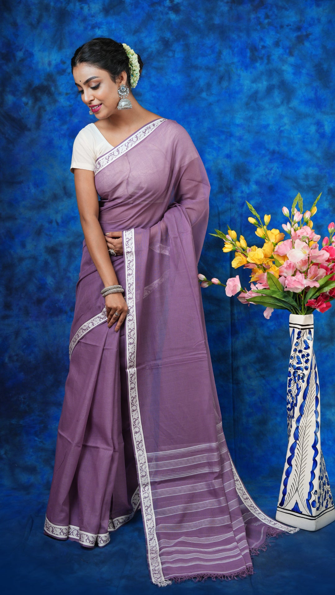 A deep mauve saree with small border
