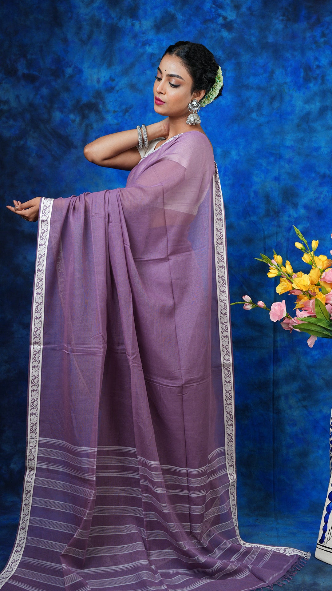 A deep mauve saree with small border