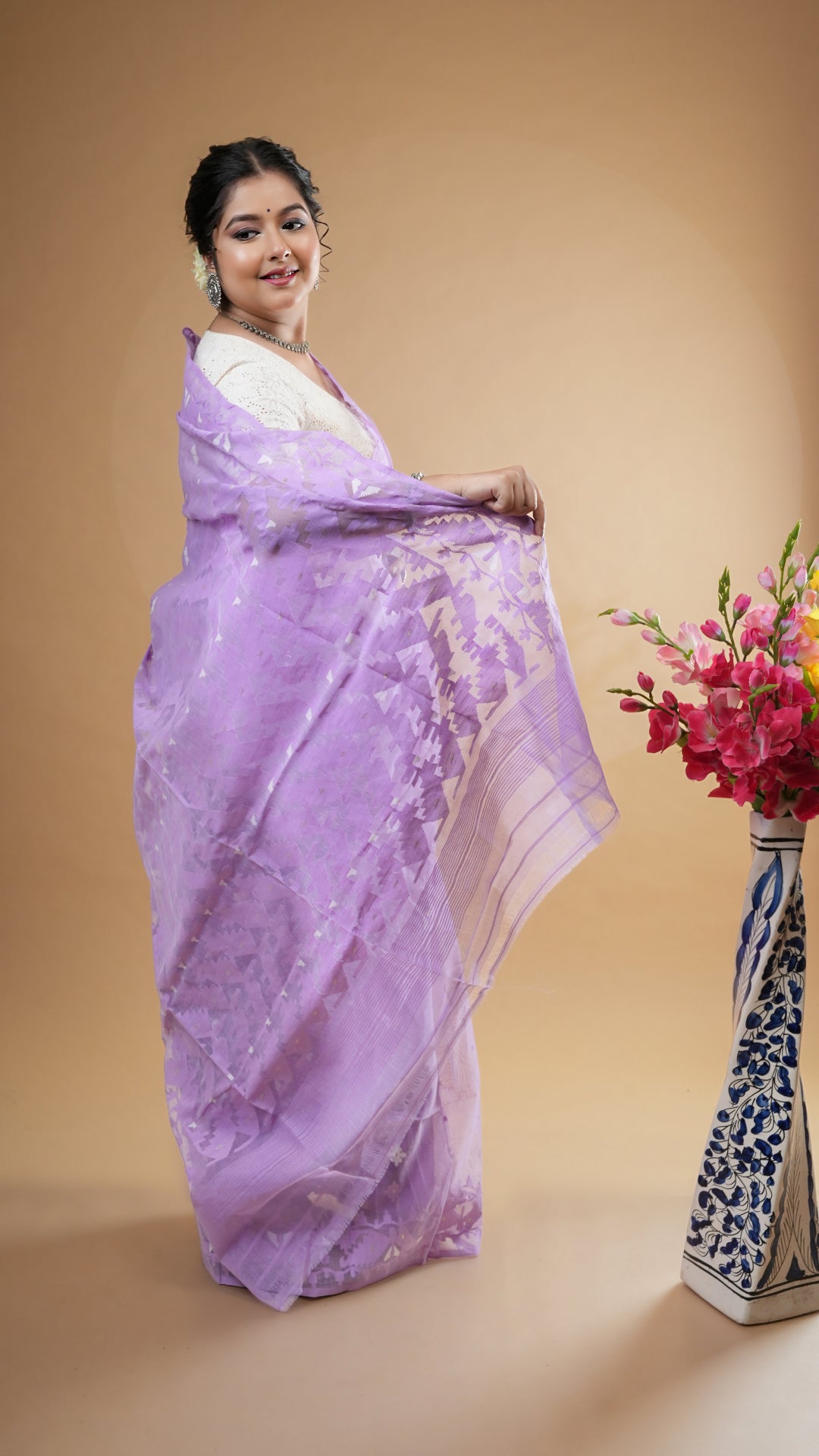 A mauve jamdani saree