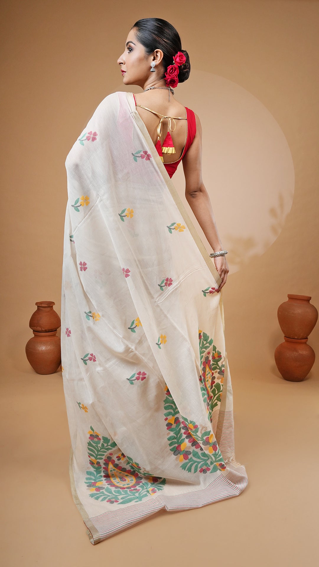 A multi coloured dhakai saree