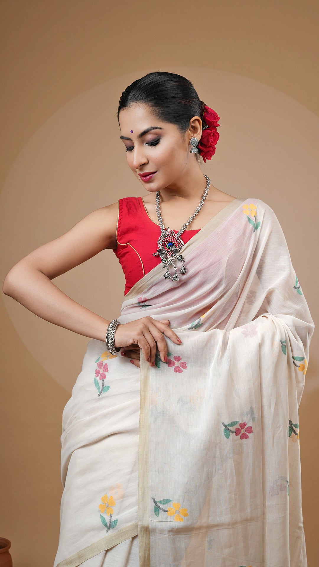 A multi coloured dhakai saree