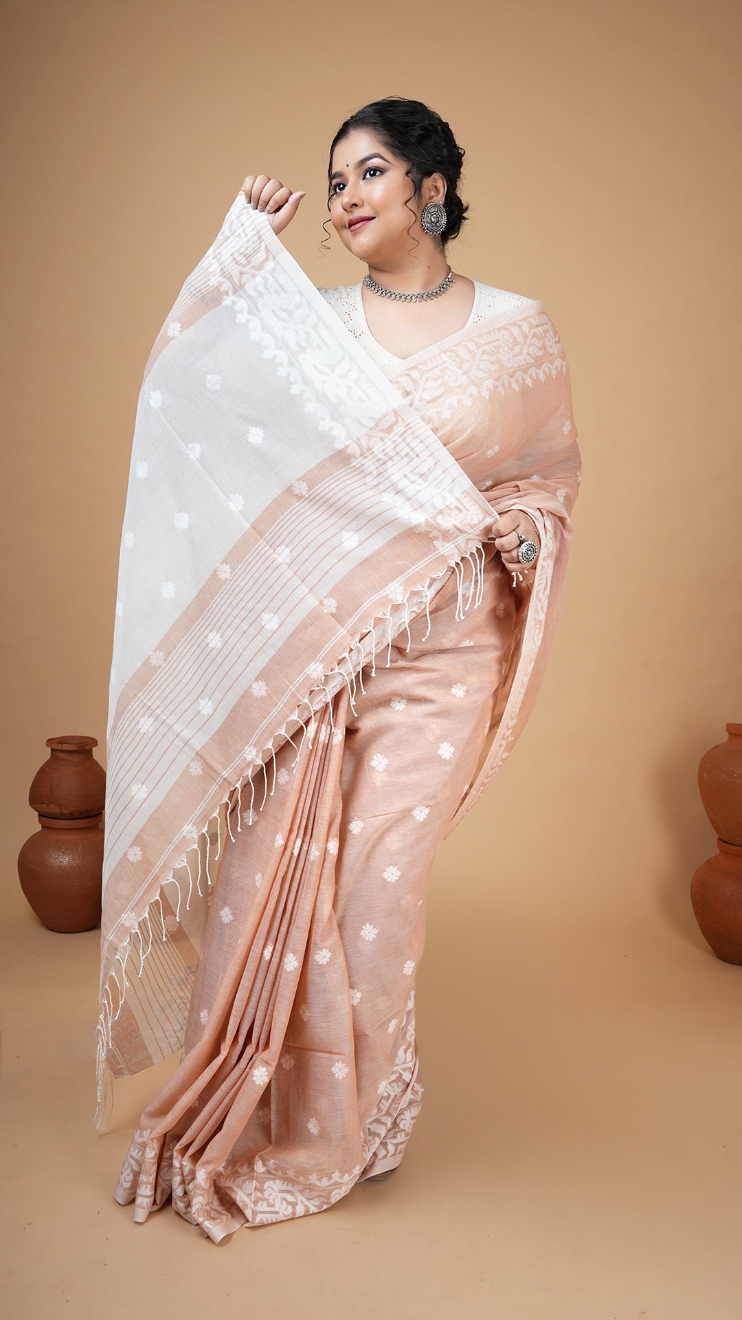 A beize coloured machine made saree
