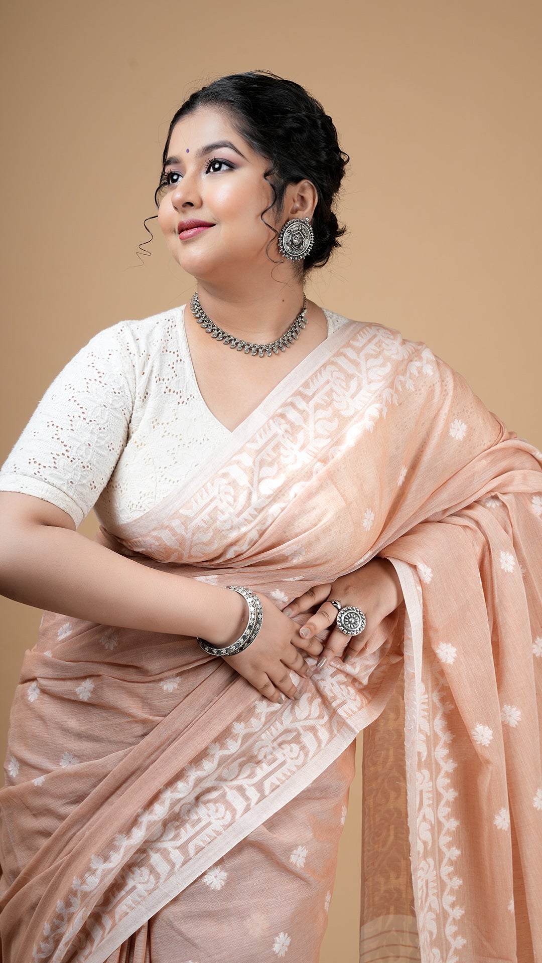 A beize coloured machine made saree
