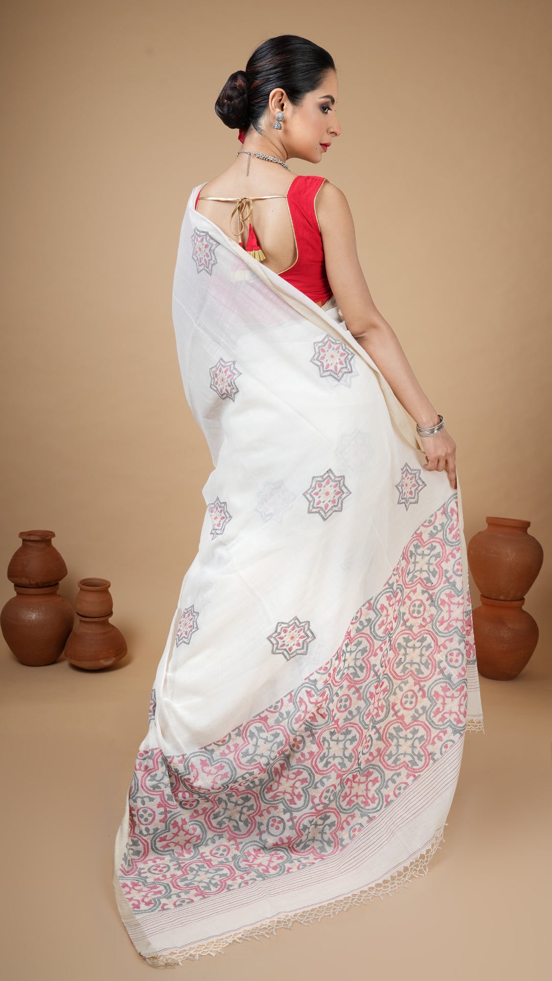 An off white with black and red dhakai