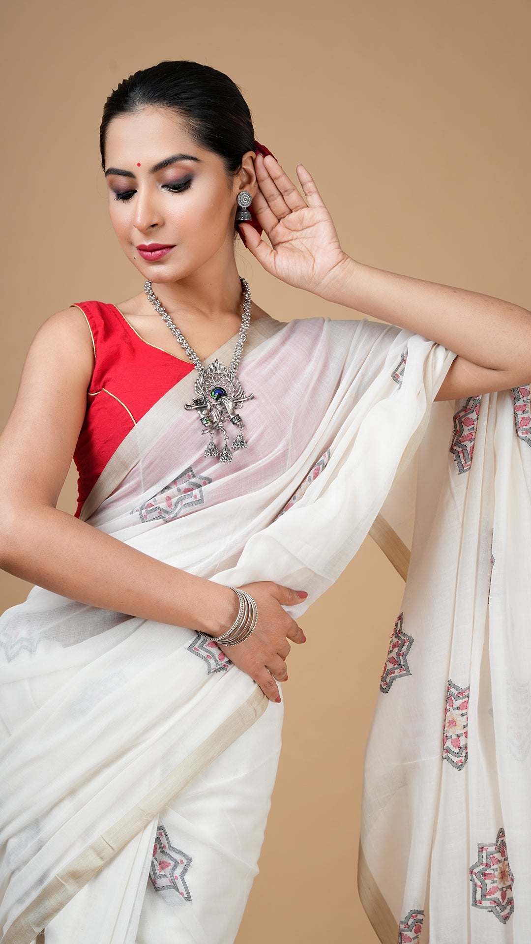 An off white with black and red dhakai