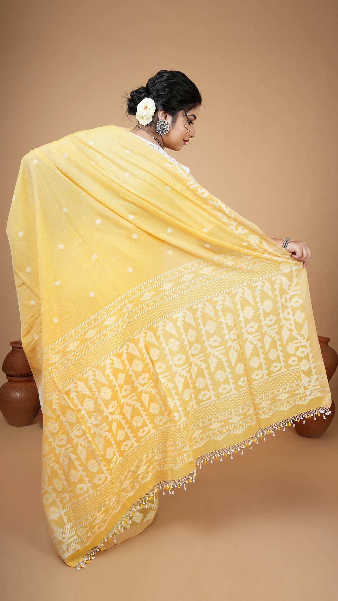A dhakai saree in yellow colour