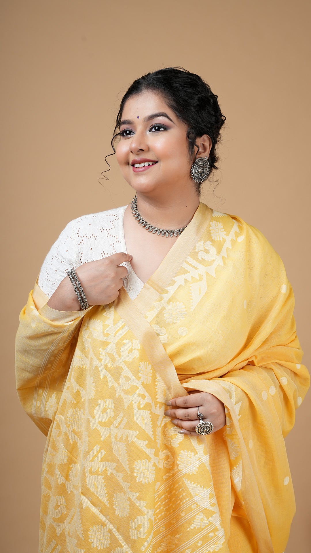 A dhakai saree in yellow colour