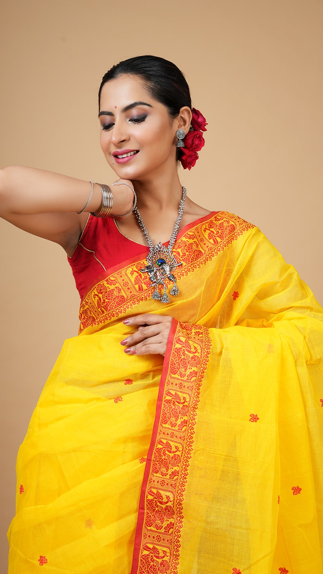 A yellow and red baluchari saree