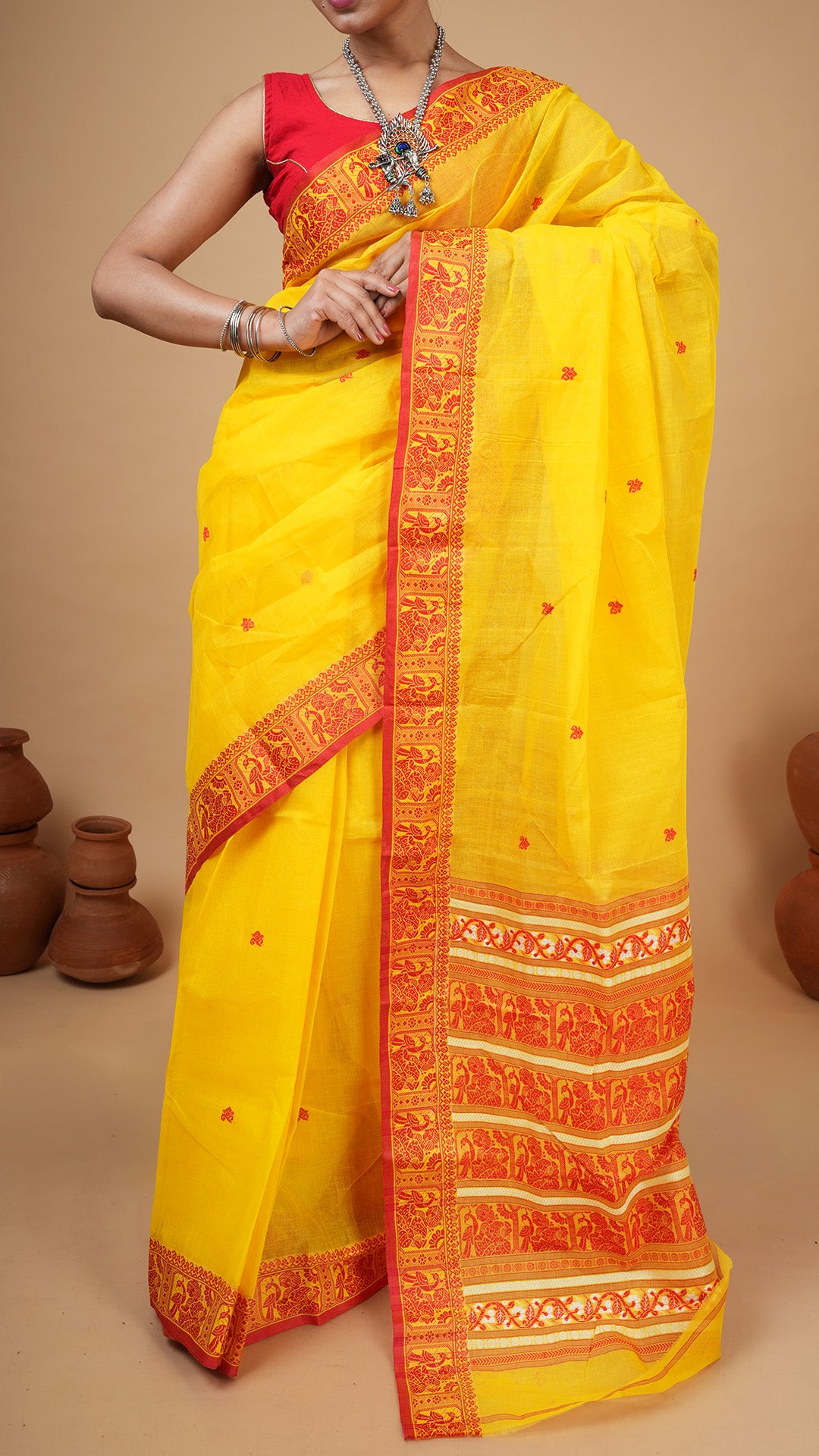 A yellow and red baluchari saree
