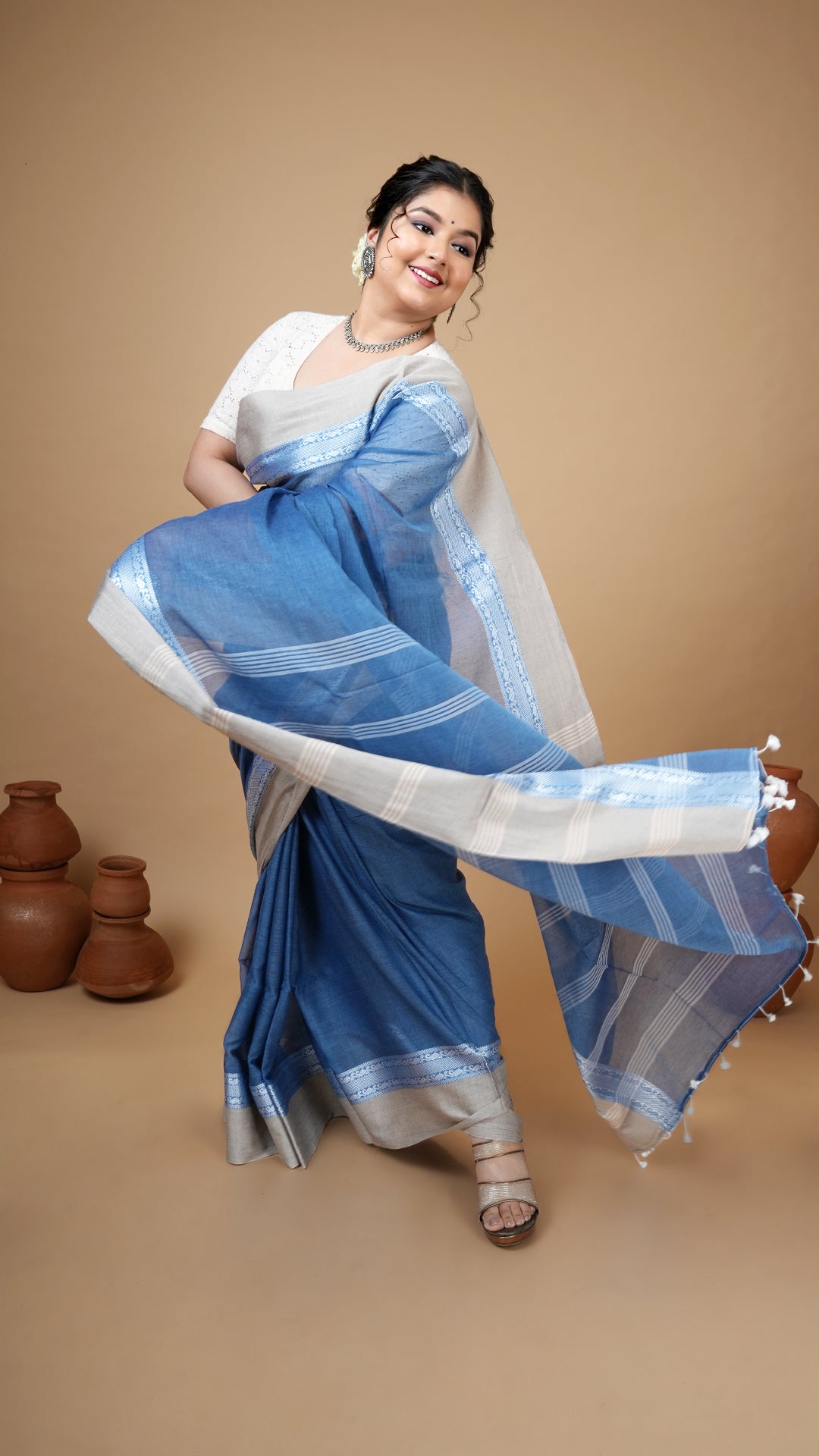 A short blue tangail saree