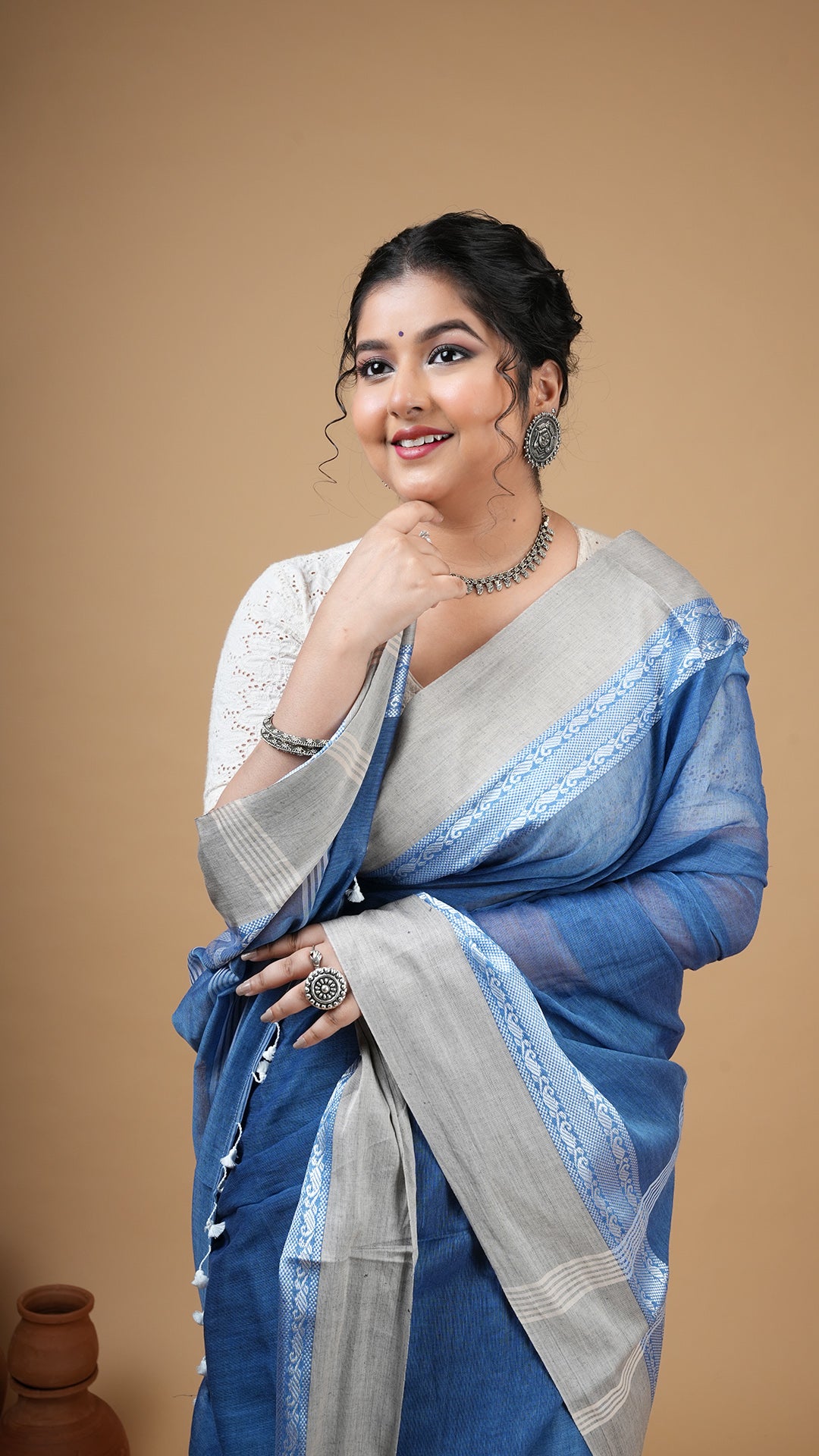 A short blue tangail saree