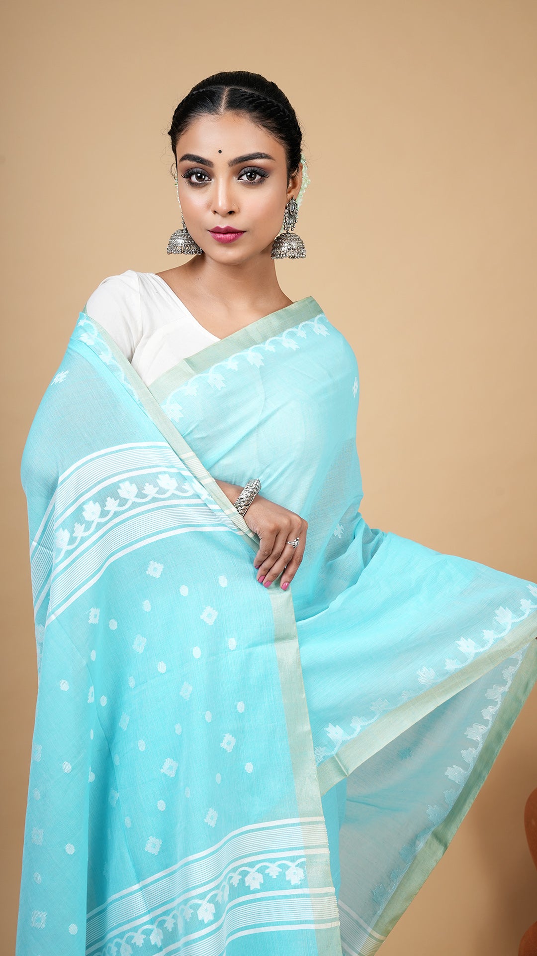 A firozi bluetangail saree
