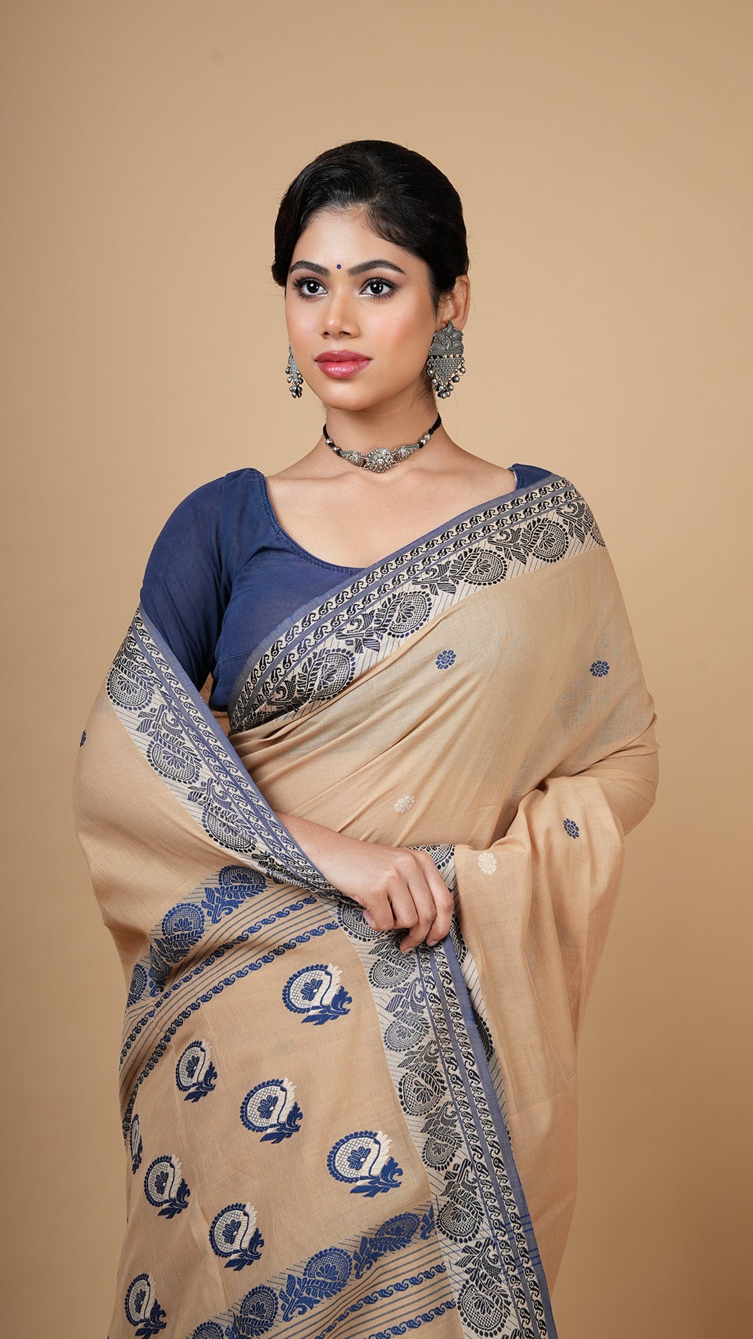 A beize and blue tangail saree