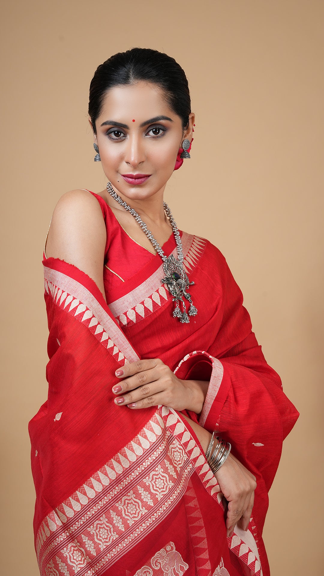 A red raw silk saree