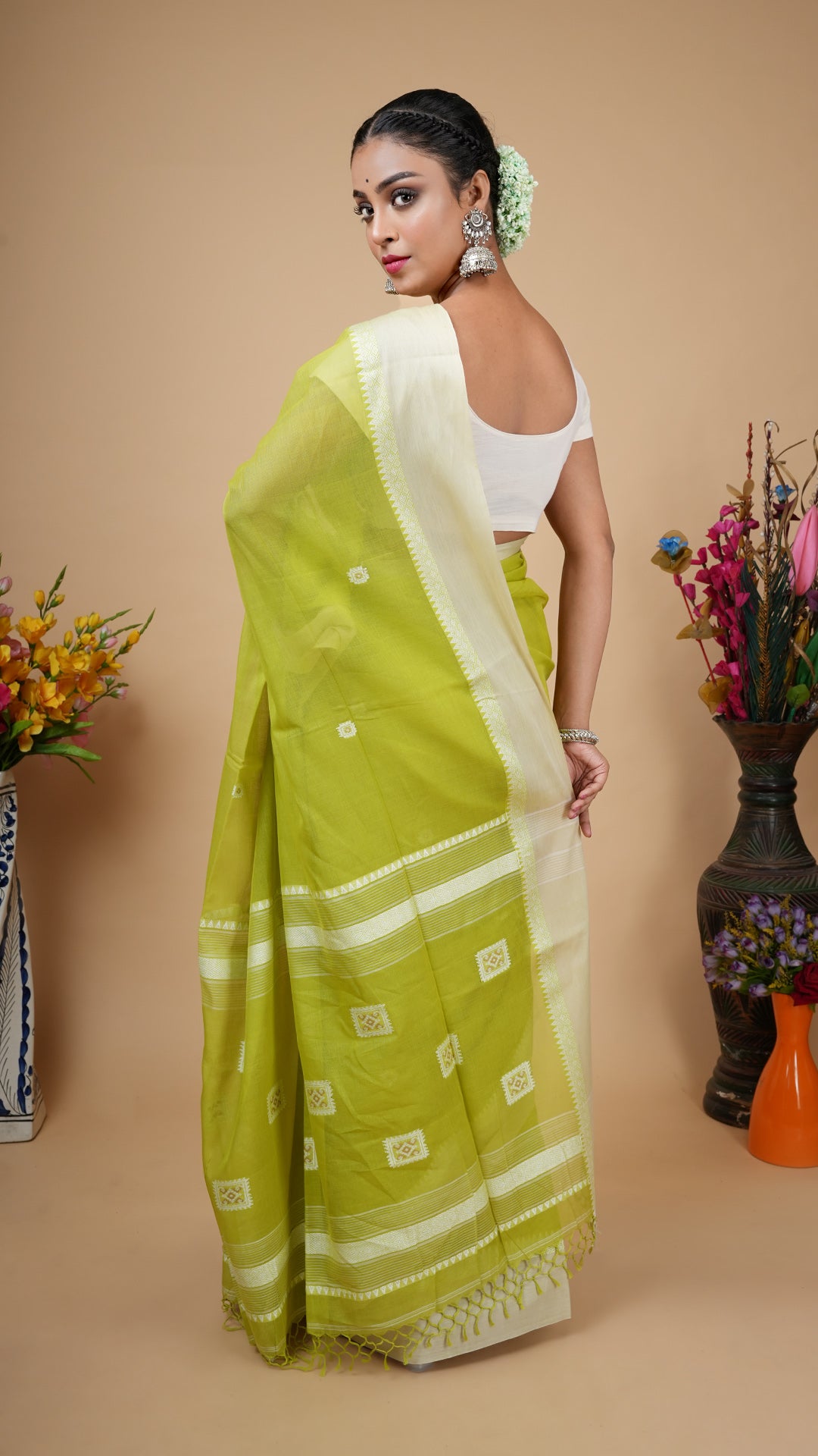 A bright green tangail saree